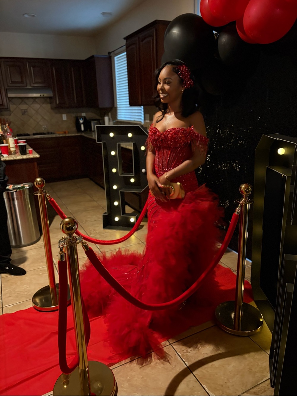 Elegant Red Off-Shoulder Prom Gown with Feathered Train